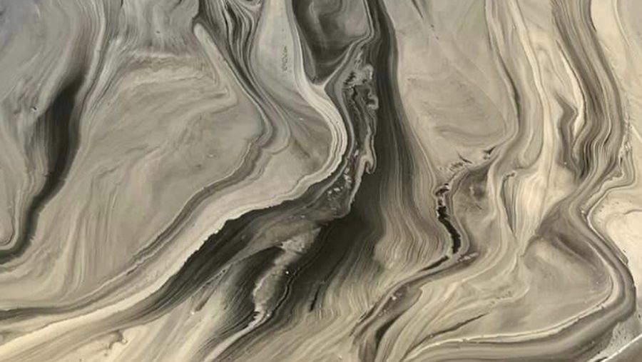 Close-up of a gray and champagne metallic epoxy floor
