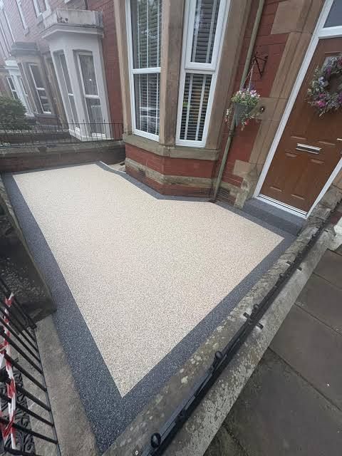 Stone walkway leading to a front door